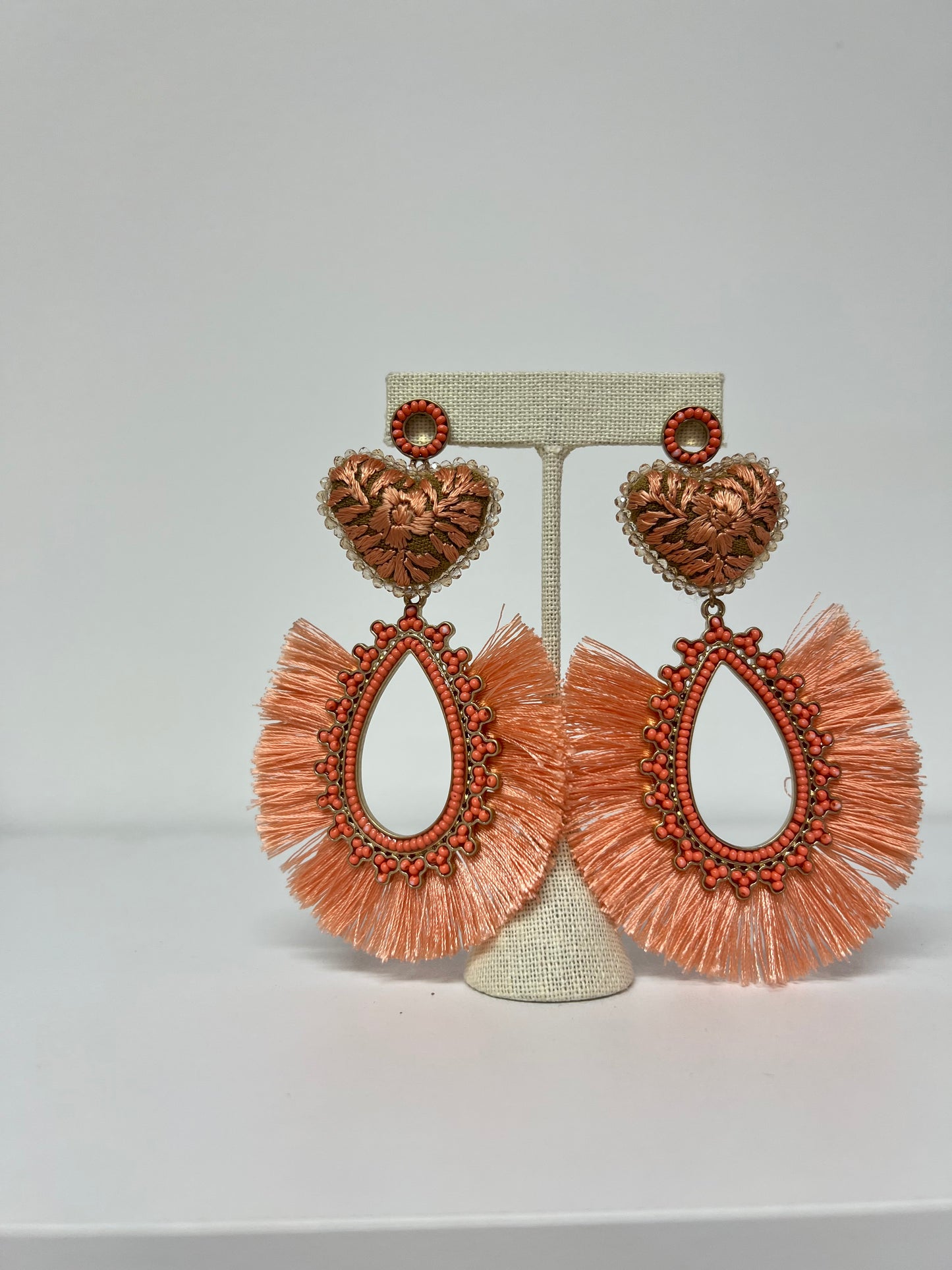 PEACH HEART EARRINGS WITH TASSEL AND GOLD EMBELLISHMENT
